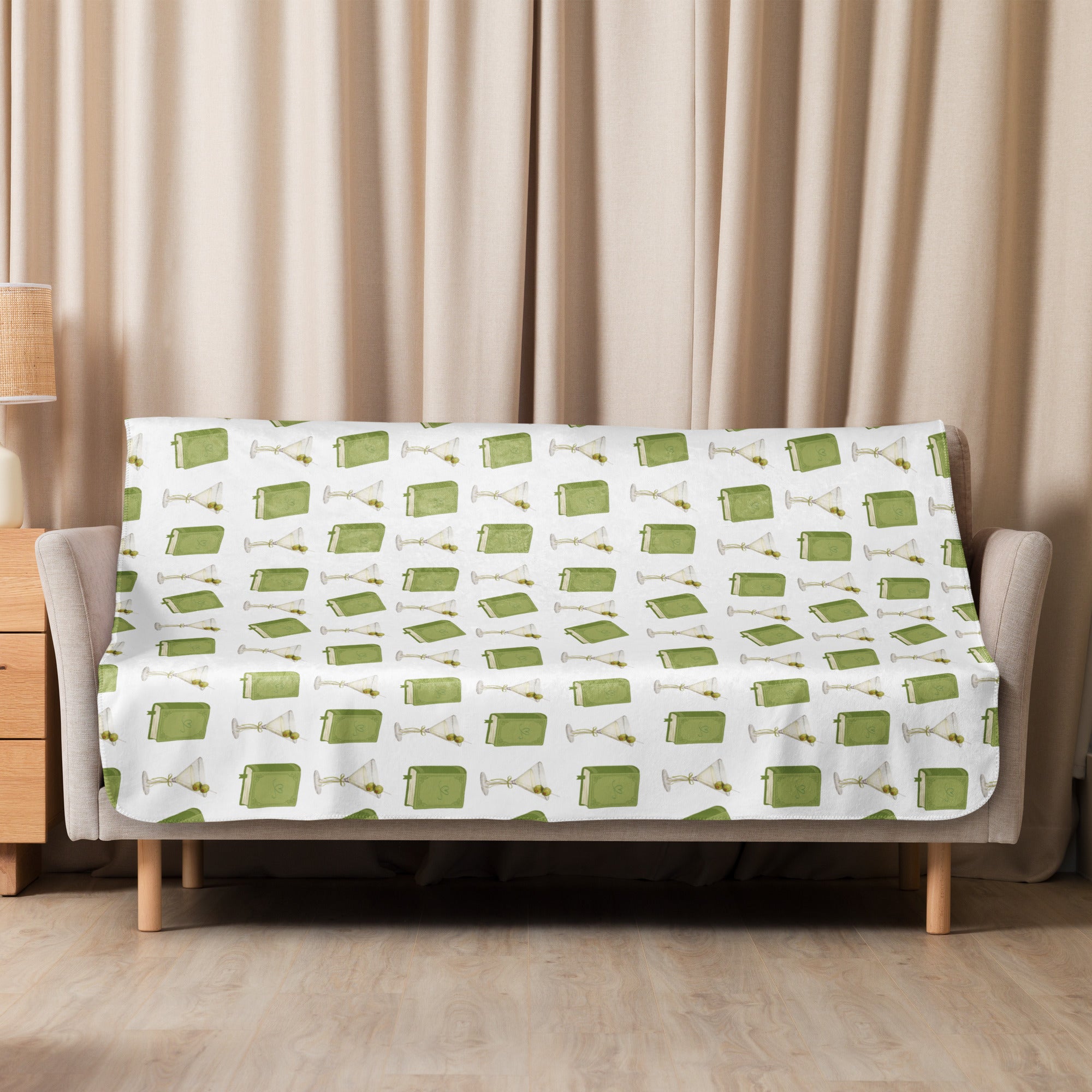 50x60" sherpa lined blanket with dirty martinis and green books on it , product mock-up image laying over couch