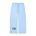 Light blue wide-leg sweatpants with a navy blue Roman numeral 'VIII' printed on the lower left leg, shown against a plain white background.