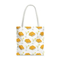 Tote bag with a pattern of books  and glasses on a white background