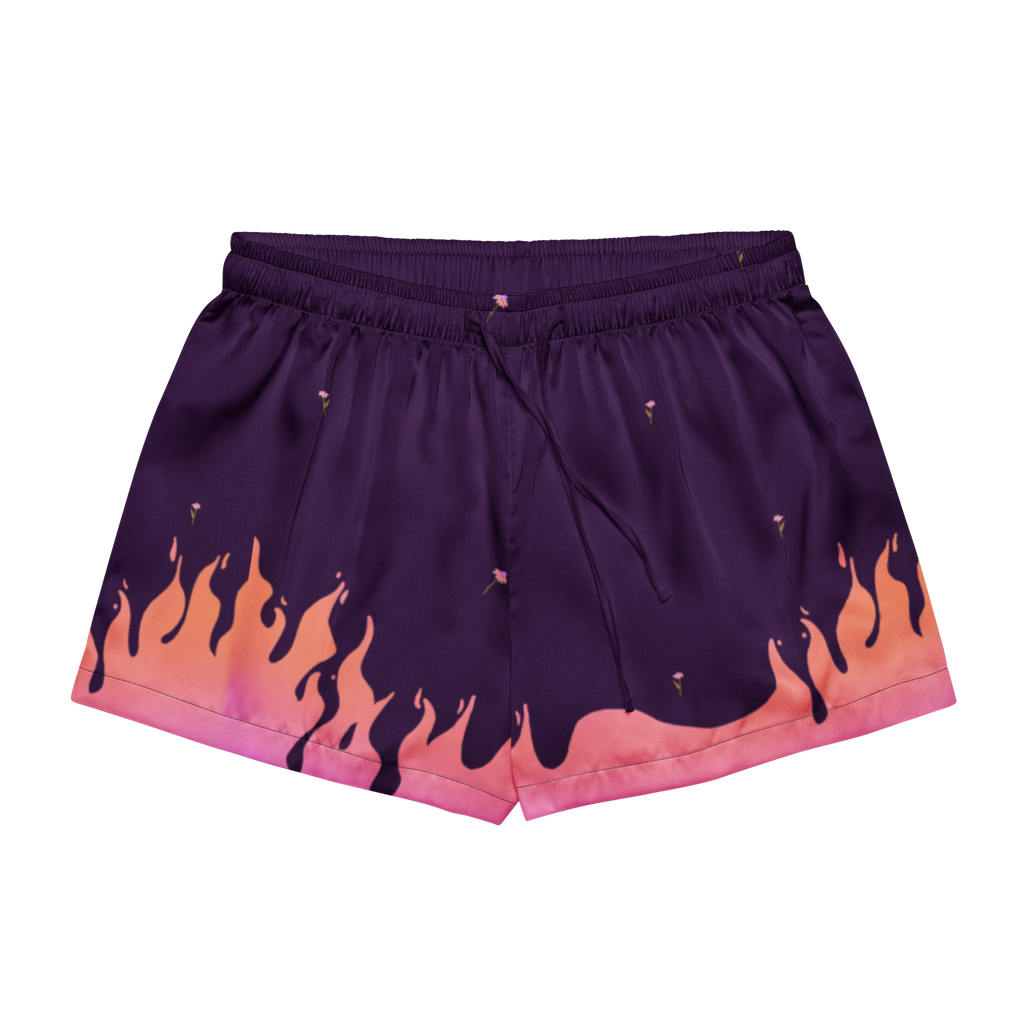 Purple athletic shorts with a flame print in orange, pink, and purple, featuring an elastic waistband and drawstring.