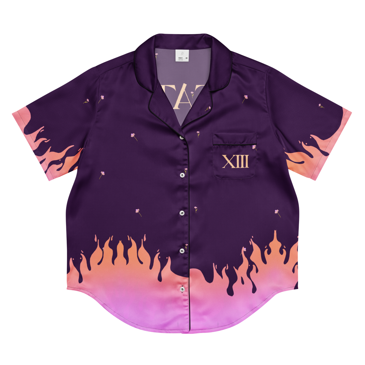 A short-sleeve button-up pajama shirt in deep purple with a pink and orange flame gradient design along the bottom hem and sleeve cuffs, featuring a chest pocket with the Roman numeral XIII.