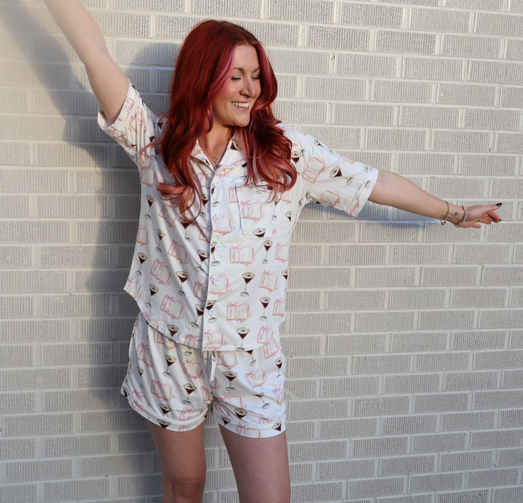 woman standing in front of wall in white pajamas with espresso martinis on them