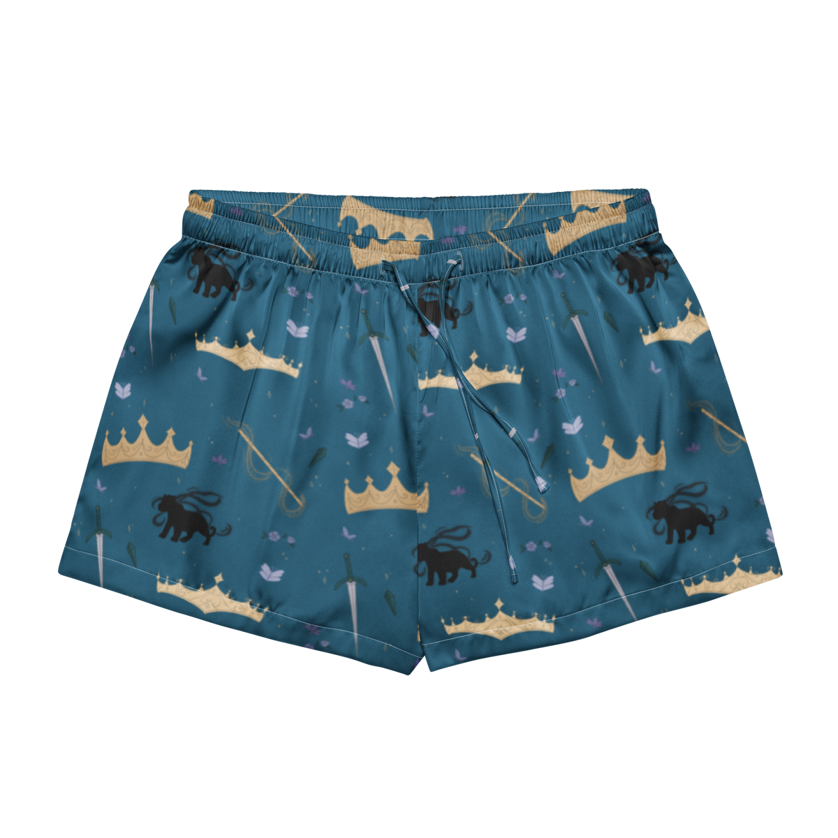A pair of teal blue athletic shorts featuring a whimsical fantasy print of gold crowns, black lions, swords, and small birds, displayed against a solid white background.
