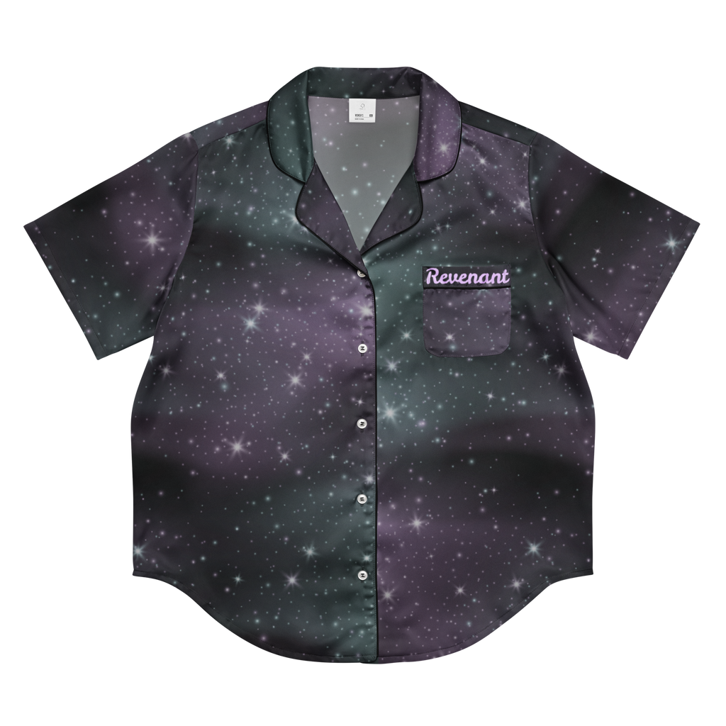 A short-sleeve button-up shirt with a galaxy print in dark purple, black, and green, featuring a chest pocket with the word 'Revenant' embroidered on it, shown on a plain white background.
