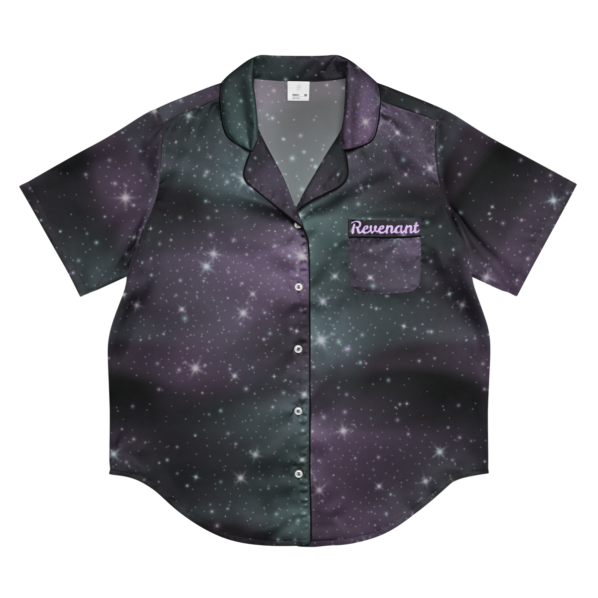 A short-sleeve button-up shirt with a galaxy print in dark purple, black, and green, featuring a chest pocket with the word 'Revenant' embroidered on it, shown on a plain white background.