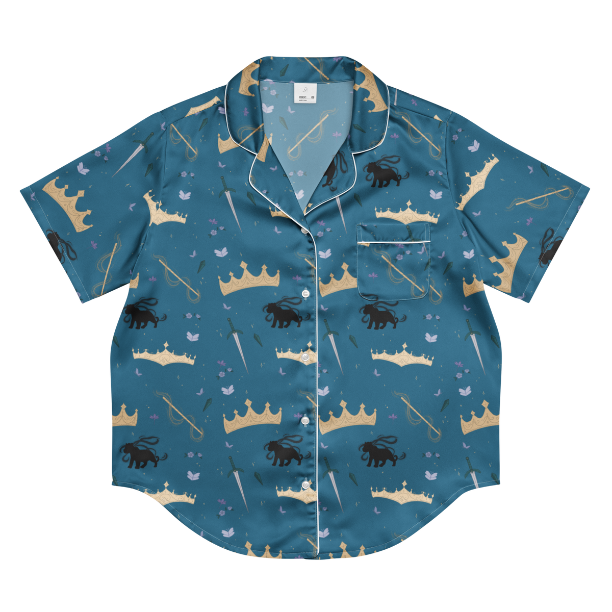 A short-sleeve button-up pajama shirt in teal blue with an all-over whimsical print of gold crowns, black lions, white birds, and white staffs, finished with white piping.