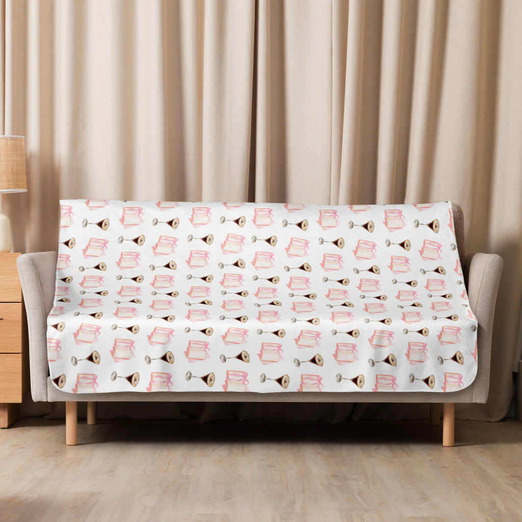 50x60  Sherpa lined blanket with espresso martinis and pink books product mock-up, laying over couch