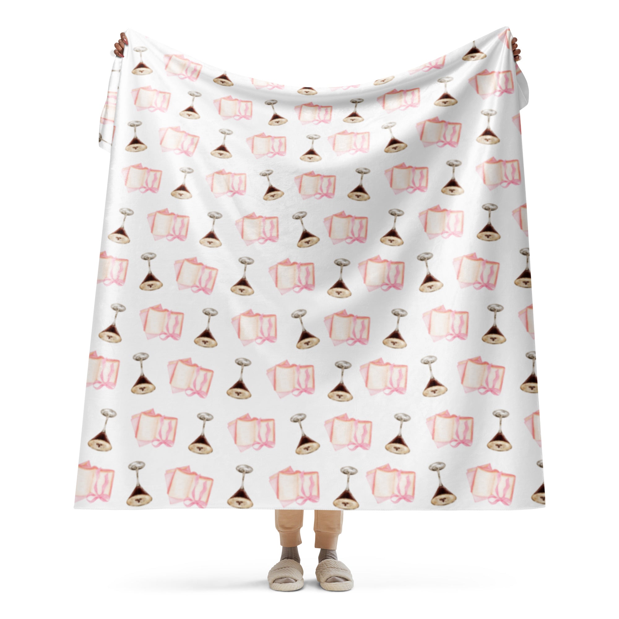 woman holding up 60x80 " Sherpa lined blanket with espresso martinis and pink books product mock-up 